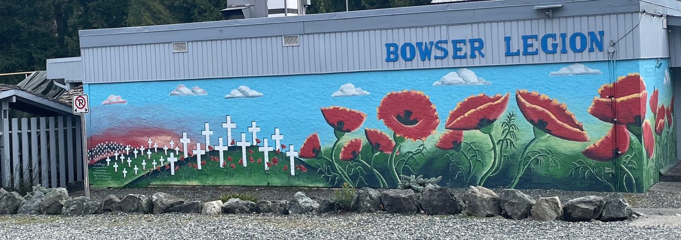 The side of the Bowser Legion: a painted mural of red poppies and rows of white crosses under a blue sky, with BOWSER LEGION in blue letters above.