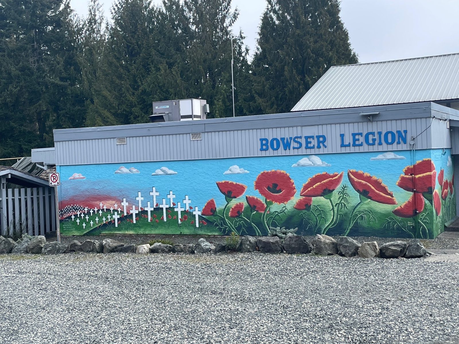 The branch building with BOWSER LEGION in blue letters above a mural of poppies and white crosses.
